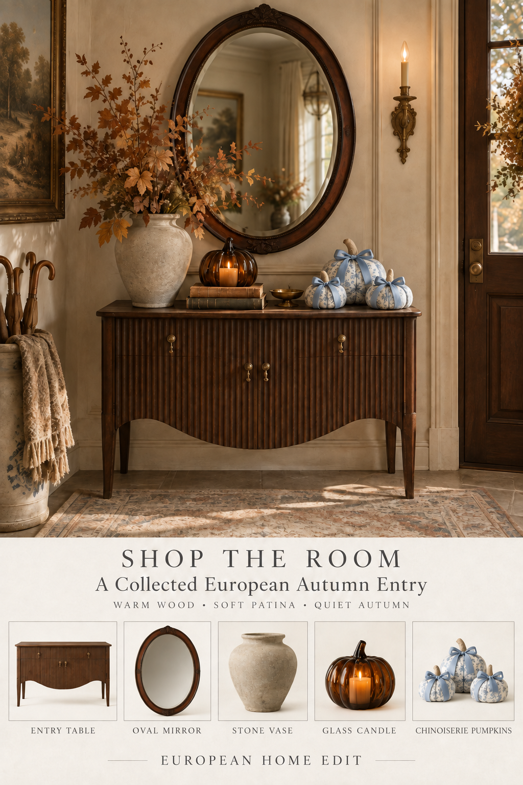 Collected European autumn entry with a dark wood entry table, oval mirror, weathered stone vase with branches, glass pumpkin candle, and blue-and-white chinoiserie pumpkins